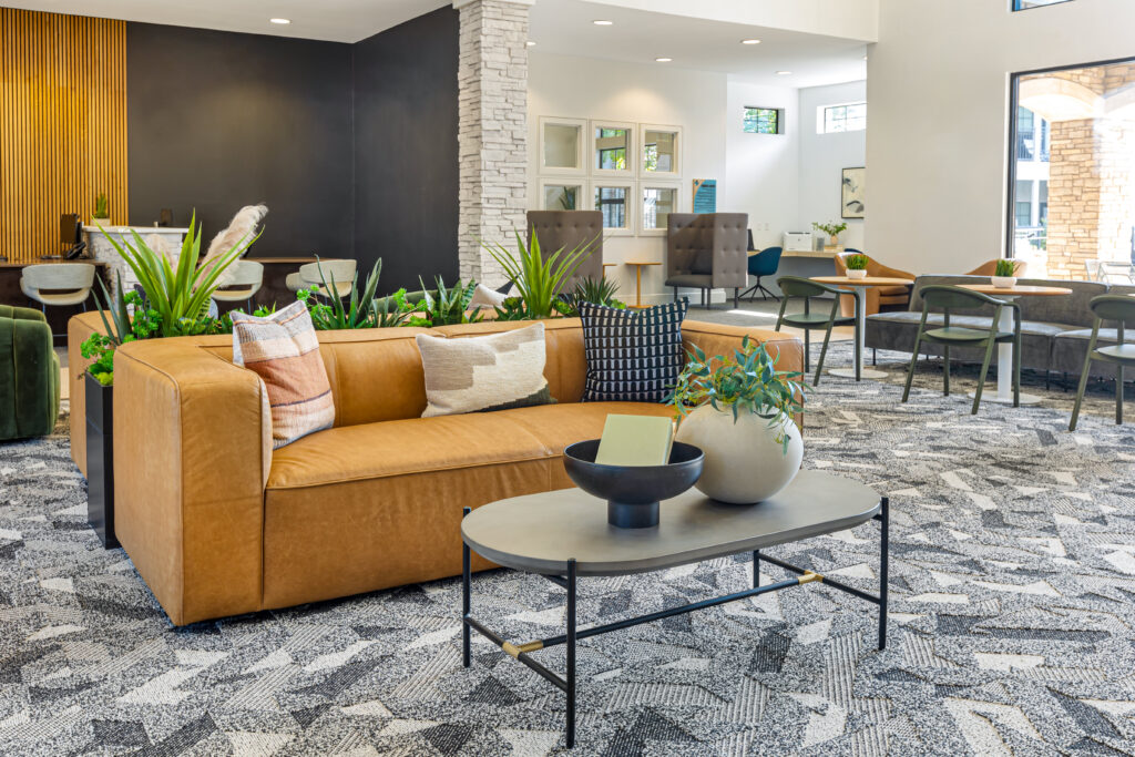 Clubhouse lounge with sofas, chairs, and booths